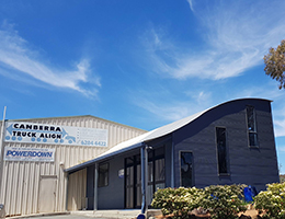 Redfoot Levelling - A building with a blue roof and a blue door in Canberra.