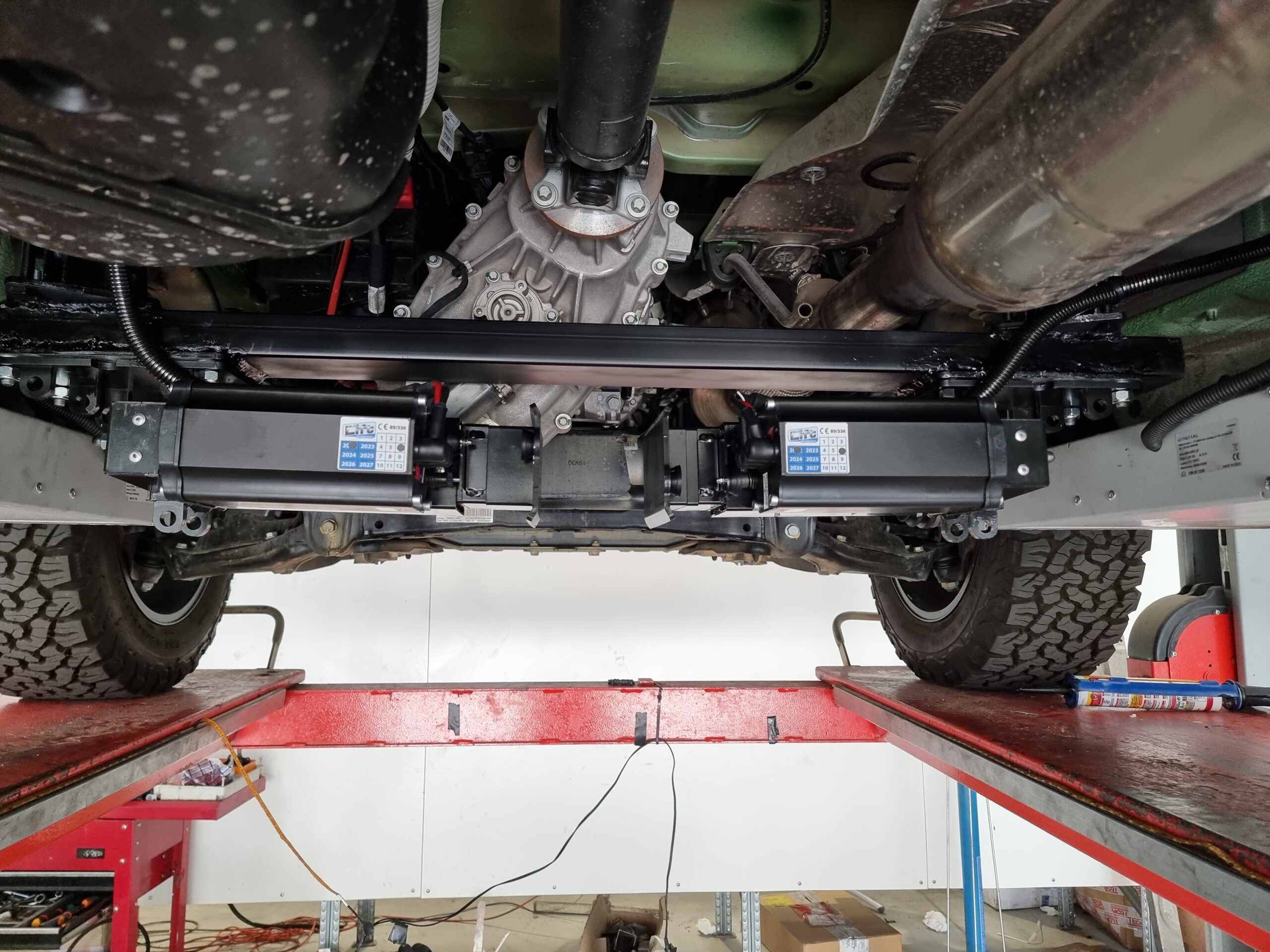 Under-chassis photo of Redfoot jacks attached